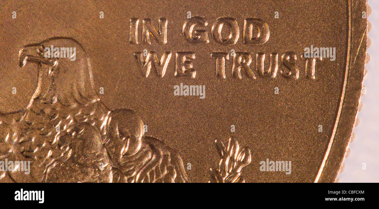 Gold Eagle one ounce coins with macro shot of the engraving of In God We Trust Stock Photo