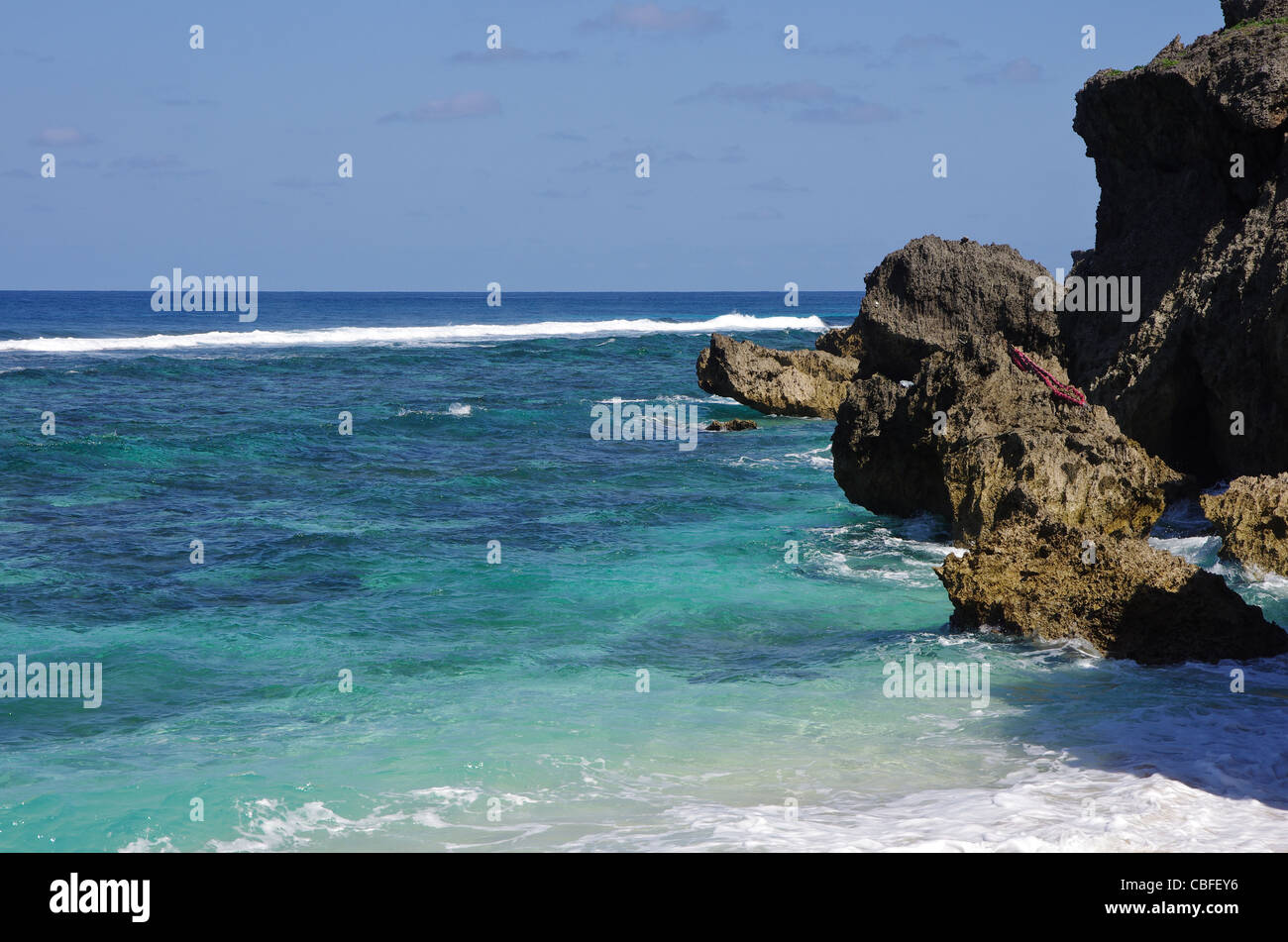 View from the Northern Coast across the turquoise sea out to the small coral reef on Yonaguni Island, Okinawa, Japan Stock Photo