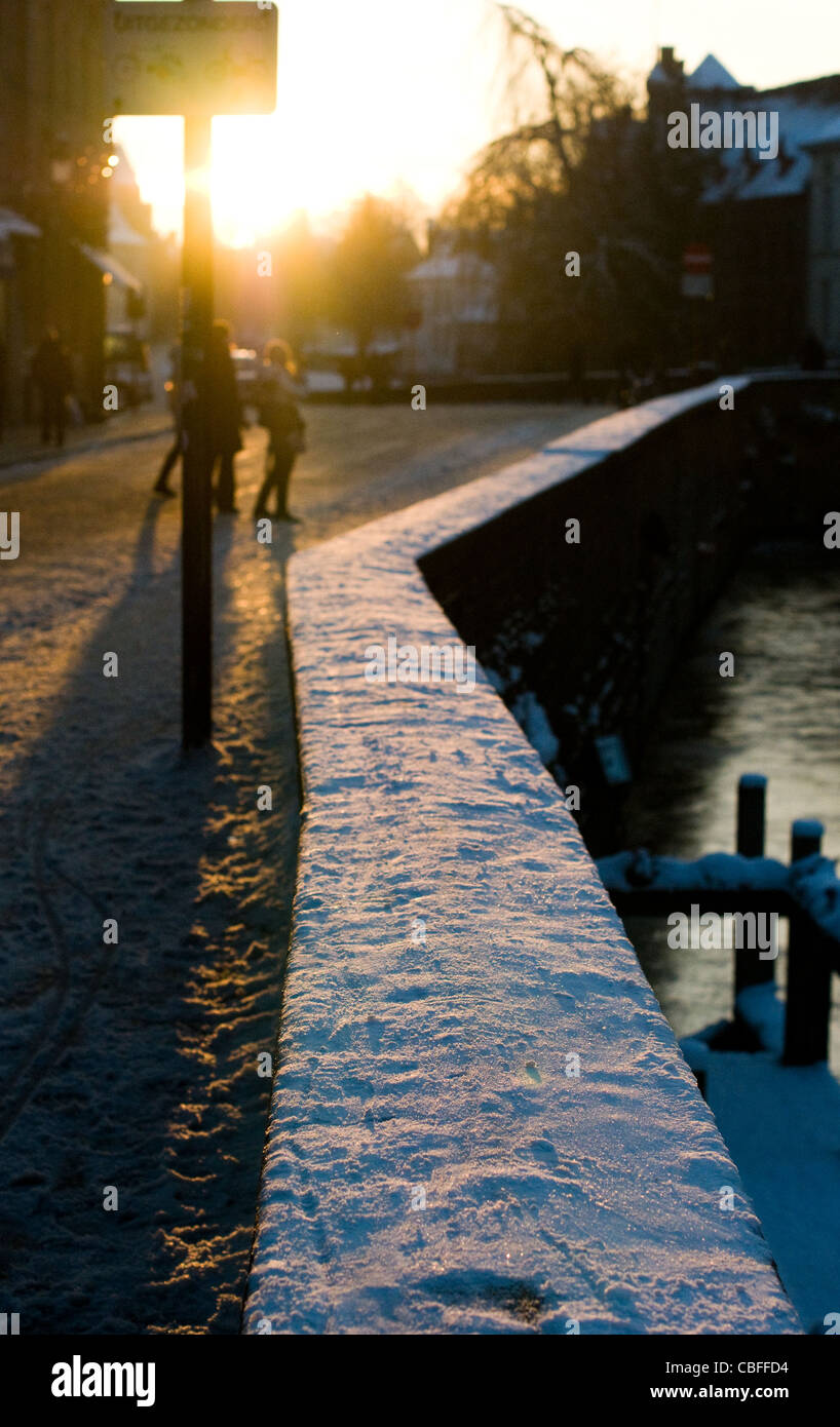 A snow covered wall in on a late afternoon in December in Bruges, Belgium. Stock Photo