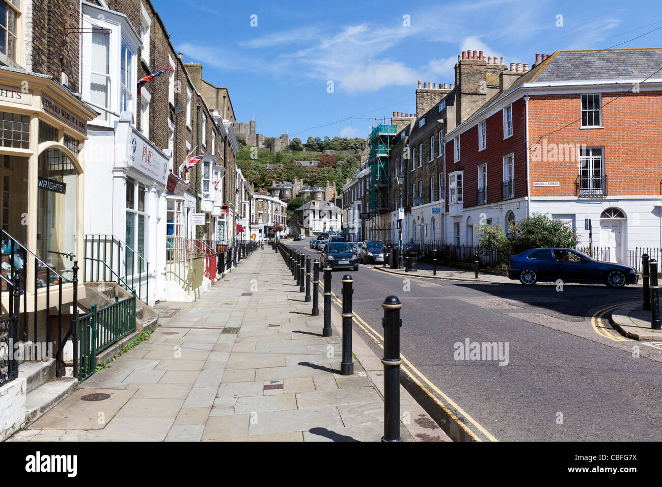 Walking along Castle Street, Dover, England with Dover Castle in view. Stock Photo