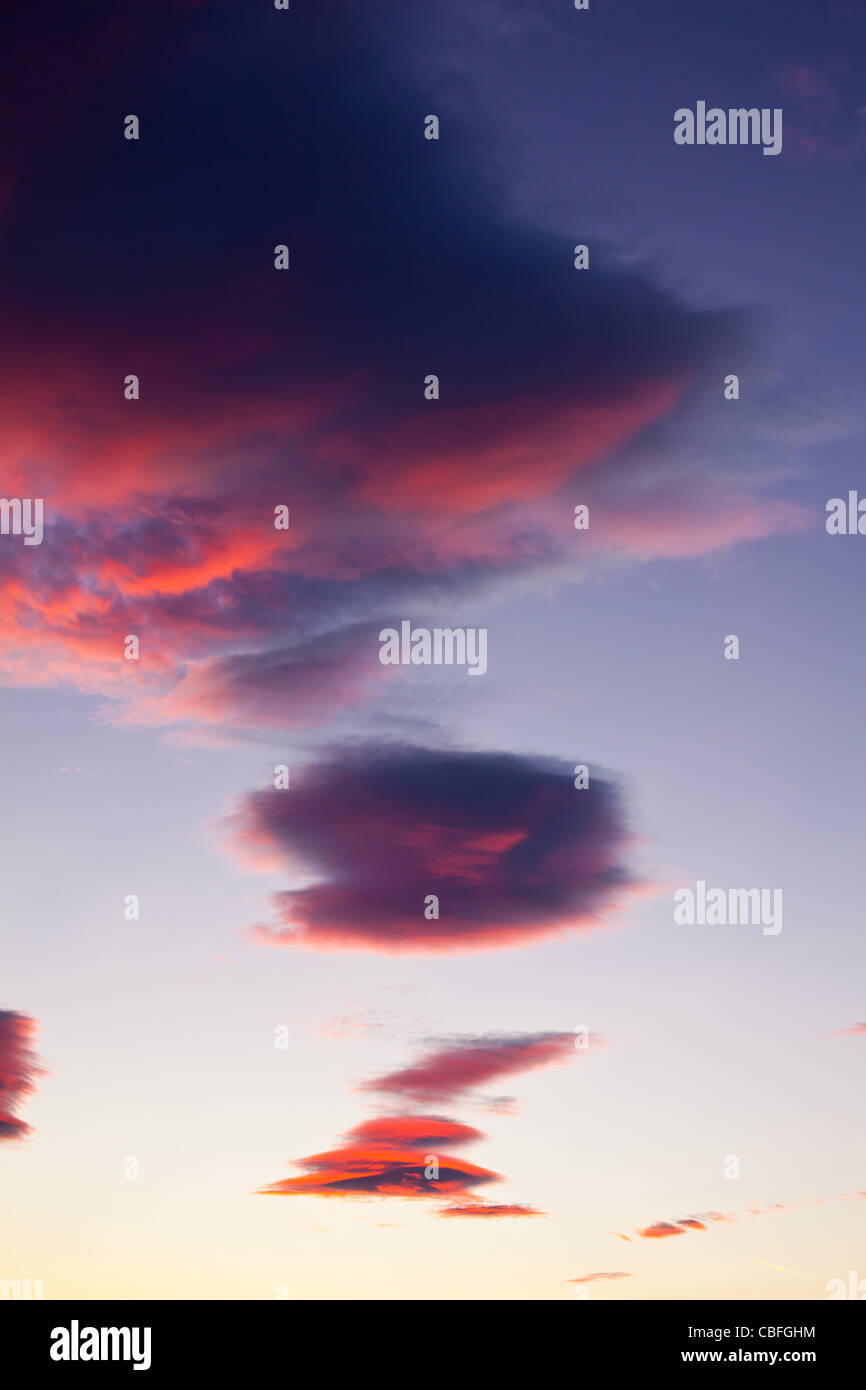 Strange formation of clouds at sunset Stock Photo - Alamy