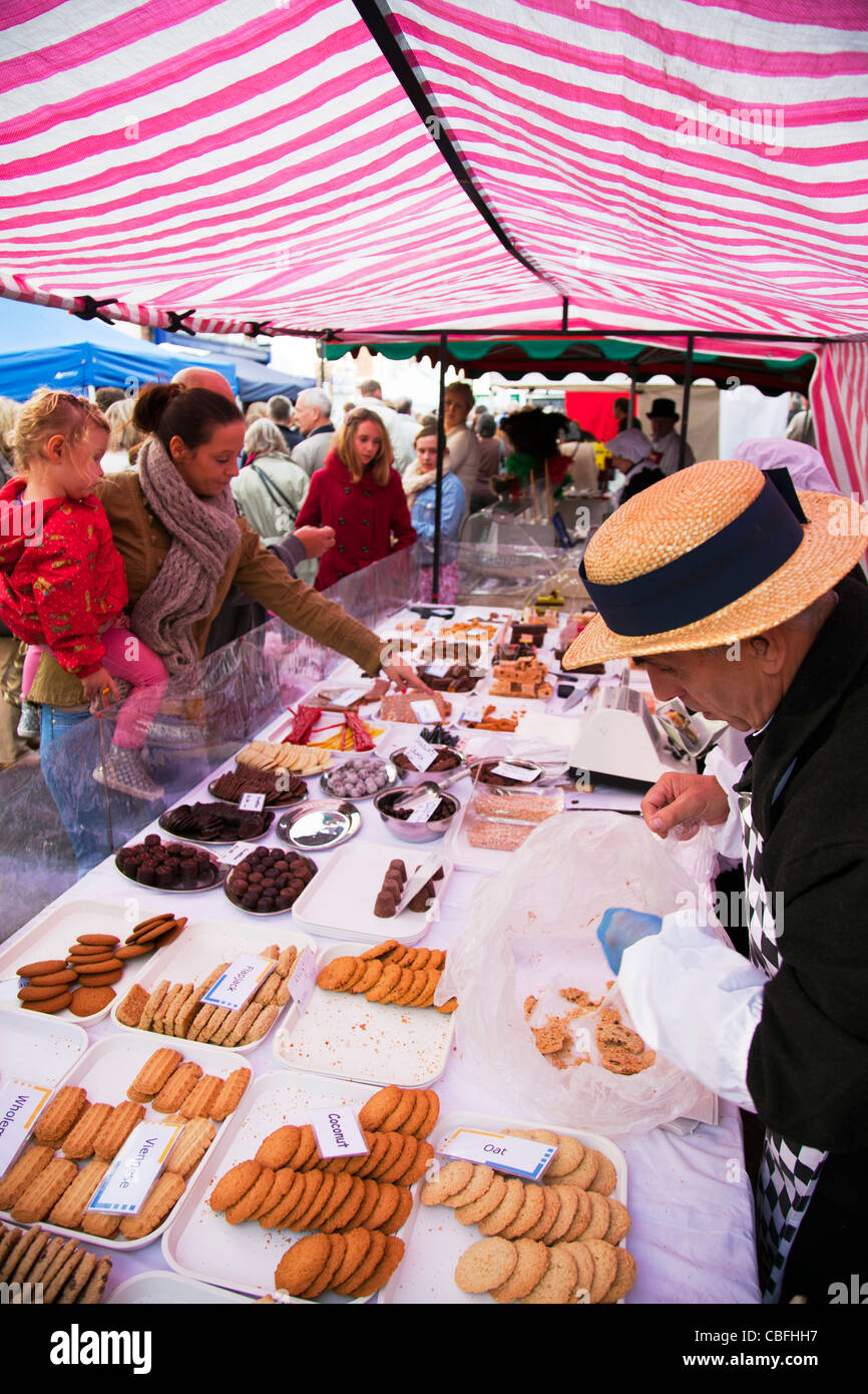 Louth Victorian Market, Lincolnshire, England lady in straw hat selling