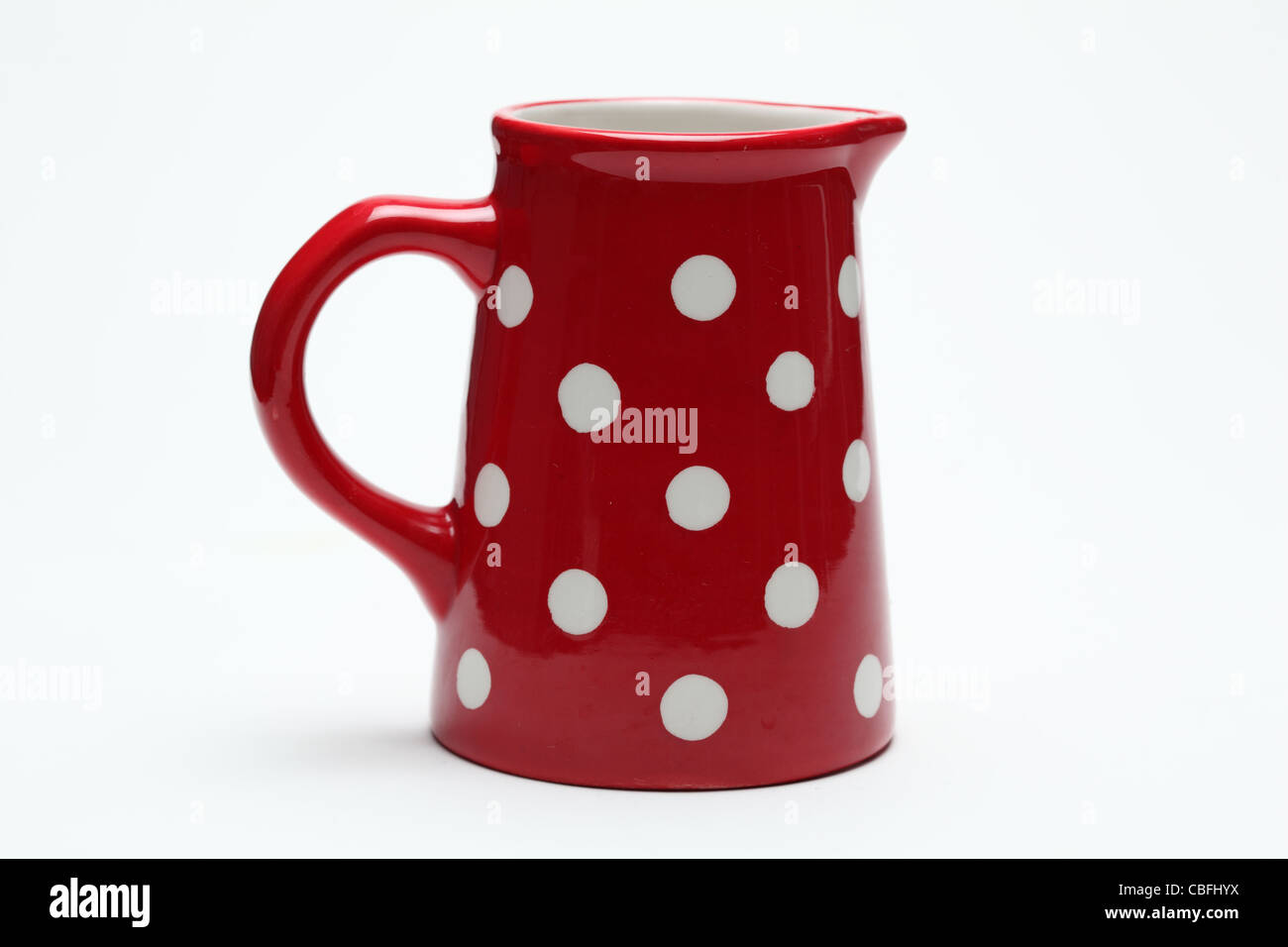 ceramic red spotty milk jug Stock Photo