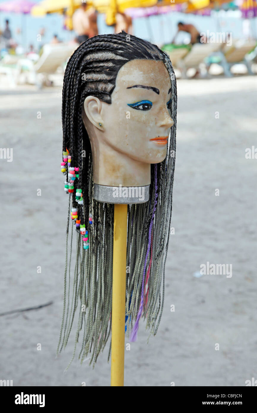 Colourful braids advertising hair braiding for tourists in Patong, Phuket,  Thailand Stock Photo - Alamy