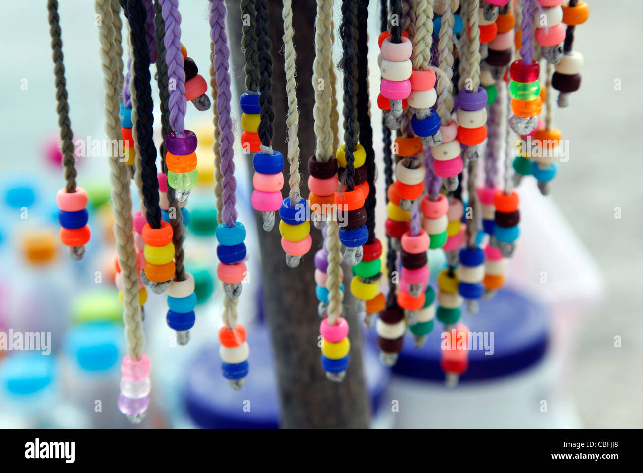 Colourful braids advertising hair braiding for tourists in Patong, Phuket,  Thailand Stock Photo - Alamy