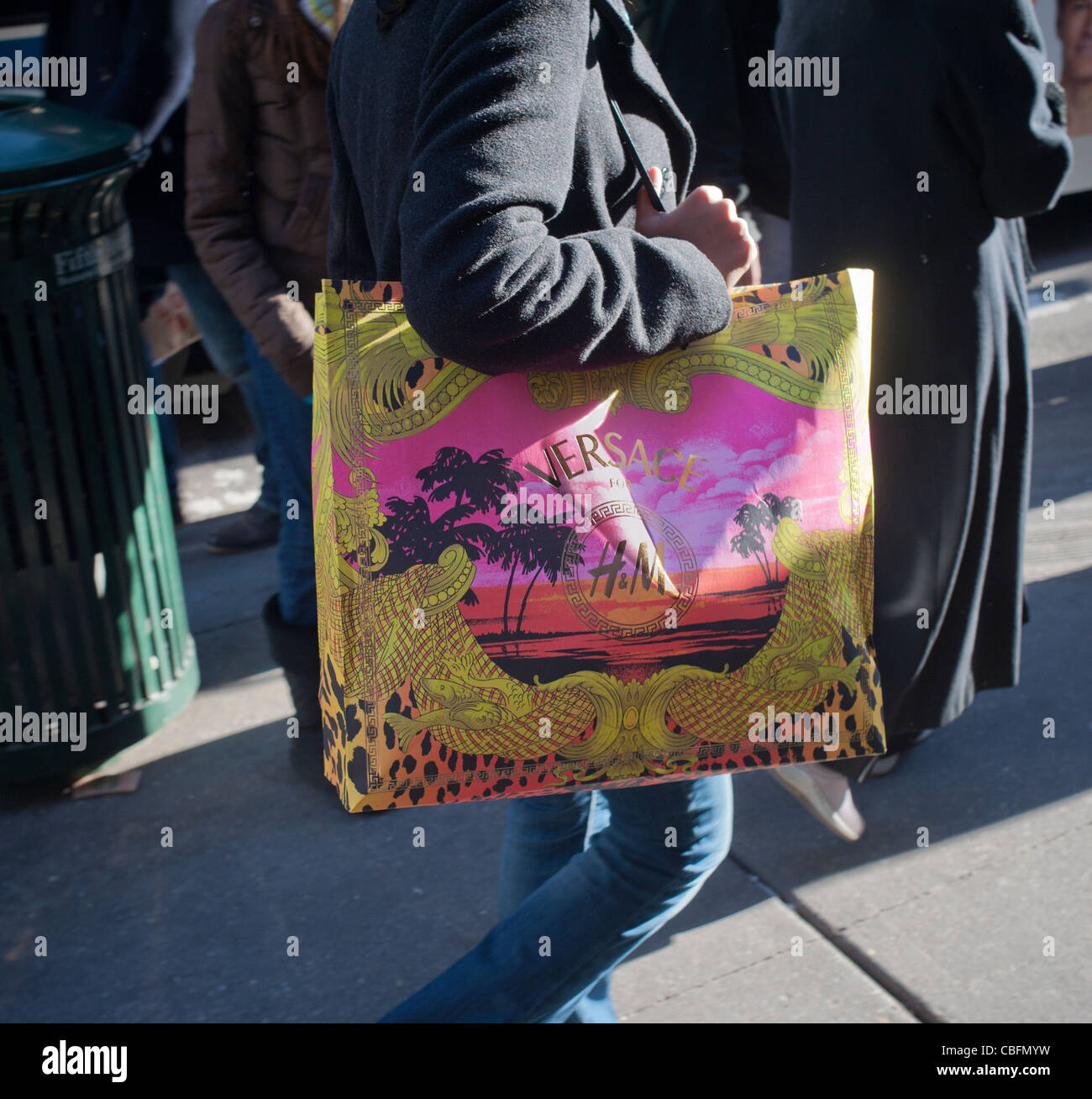 A shopper with a Versace H&M shopping bag on Fifth Avenue in New York Stock  Photo - Alamy