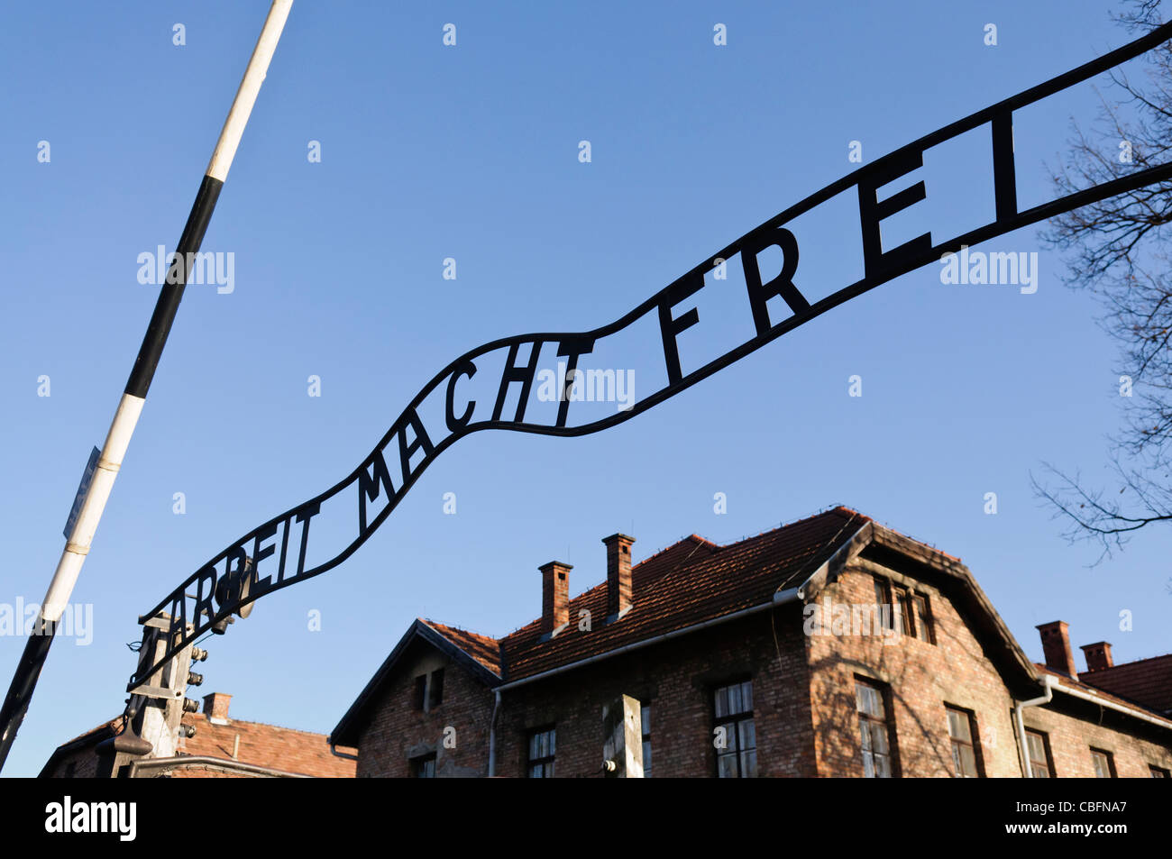 Main entrance to Auschwitz I Nazi concentration camp with sign 'Arbeit Macht Frei' Stock Photo