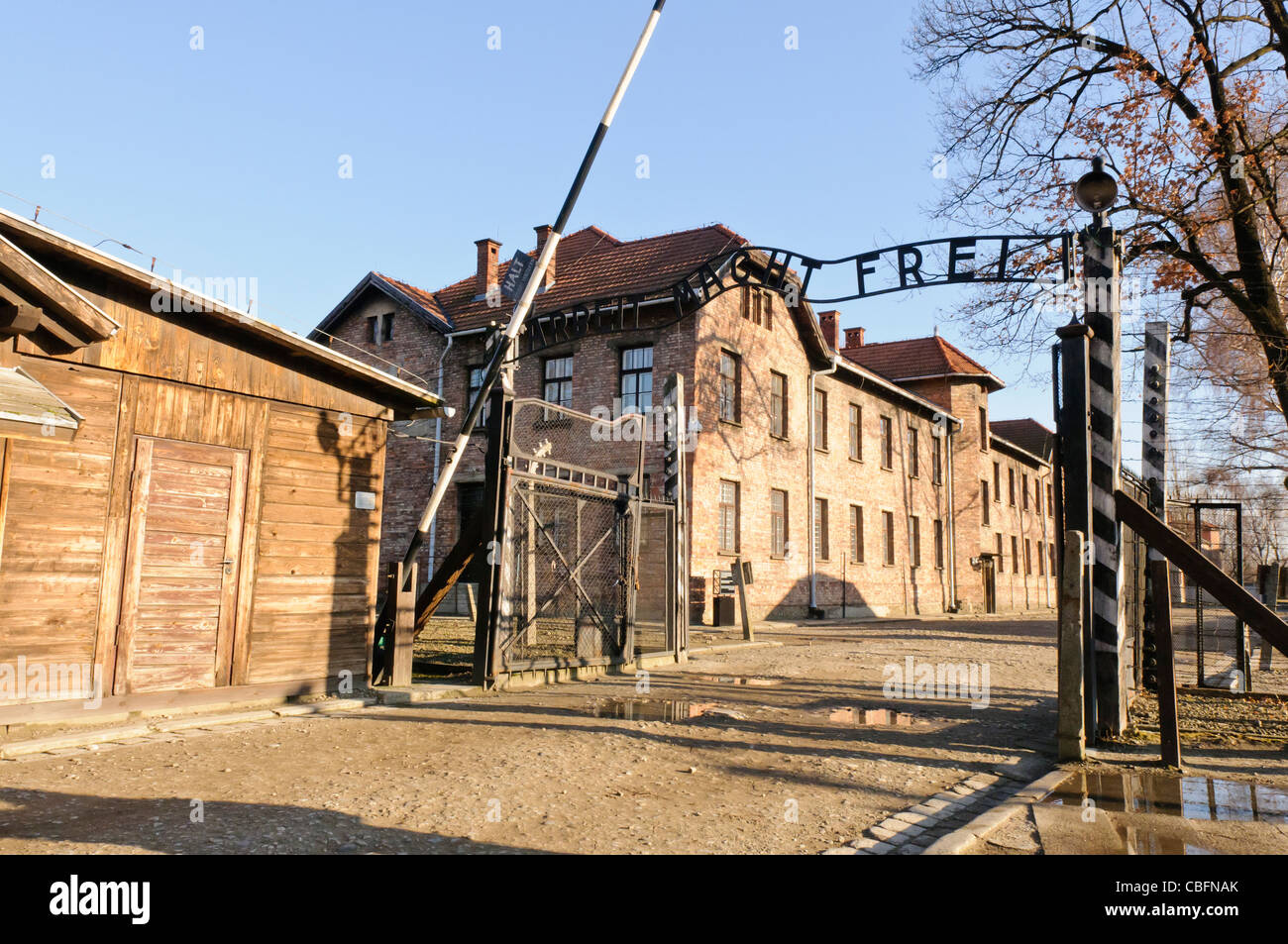 Main entrance to Auschwitz I Nazi concentration camp with sign 'Arbeit Macht Frei' Stock Photo
