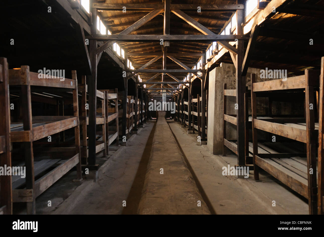 Wooden barracks in Auschwitz Berkenhau II concentration camp, each designed to hold 550 prisoners, but in reality housed over 1,000 prisoners. Stock Photo