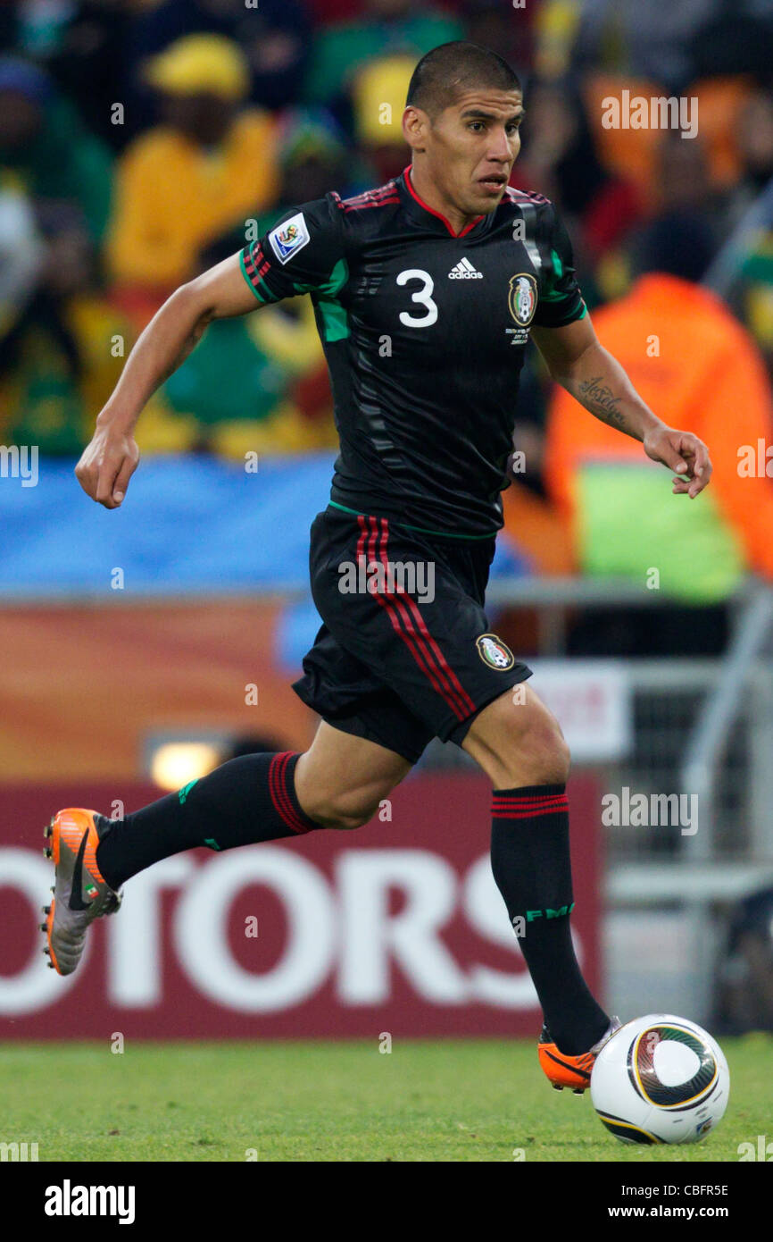 Carlos Salcido of Mexico drives the ball during the opening match of the 2010 FIFA World Cup against South Africa. Stock Photo