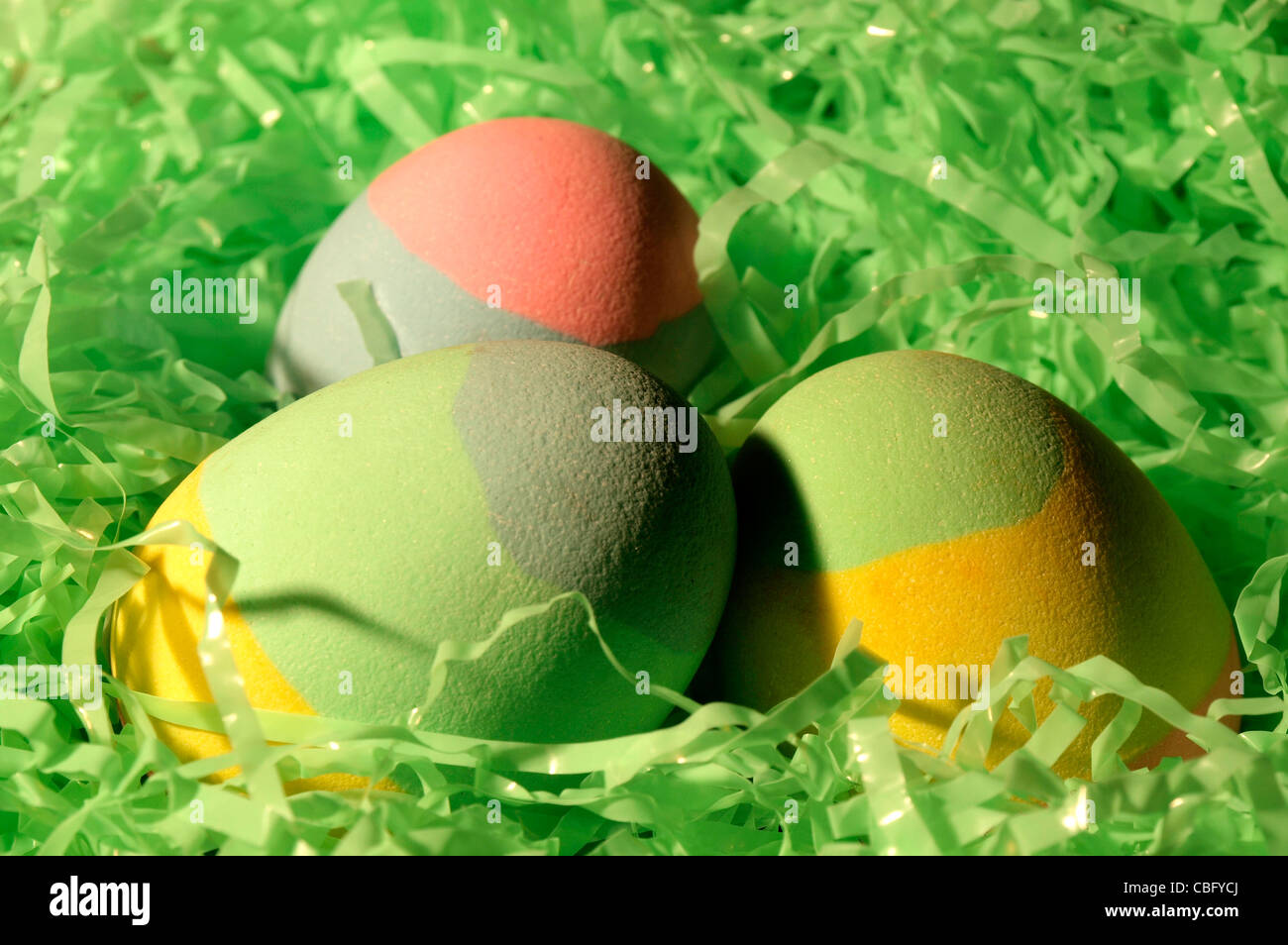 Easter Eggs Nestled in Green (fake) grass Stock Photo