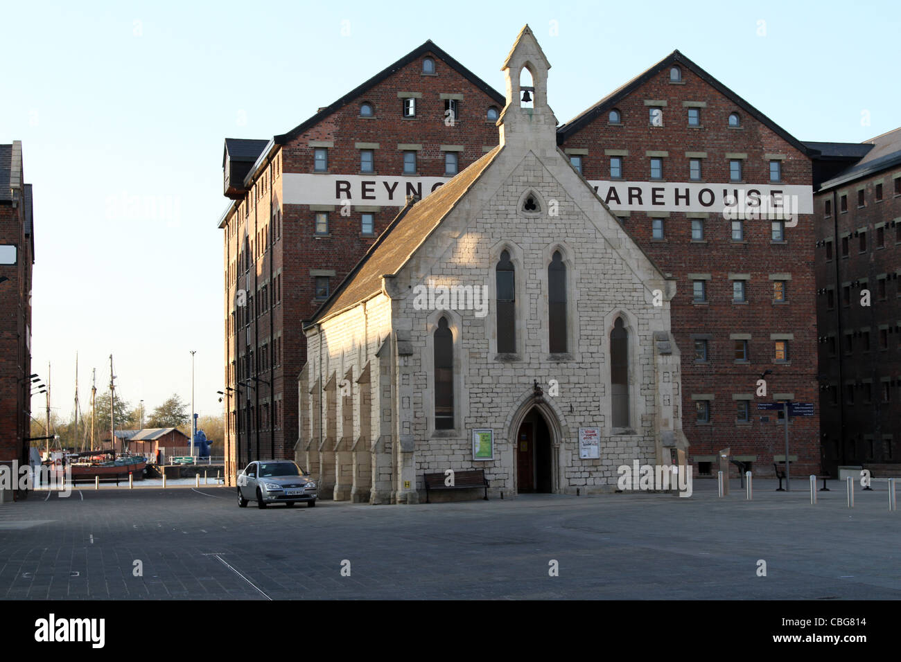 Chapel in front of warehouse converted into flats at Gloucester Quays