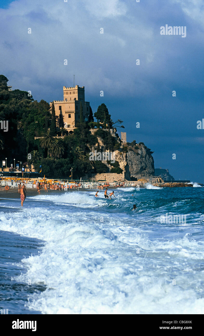 View of a beach and a castle in the background, Liguria, Italy Stock Photo