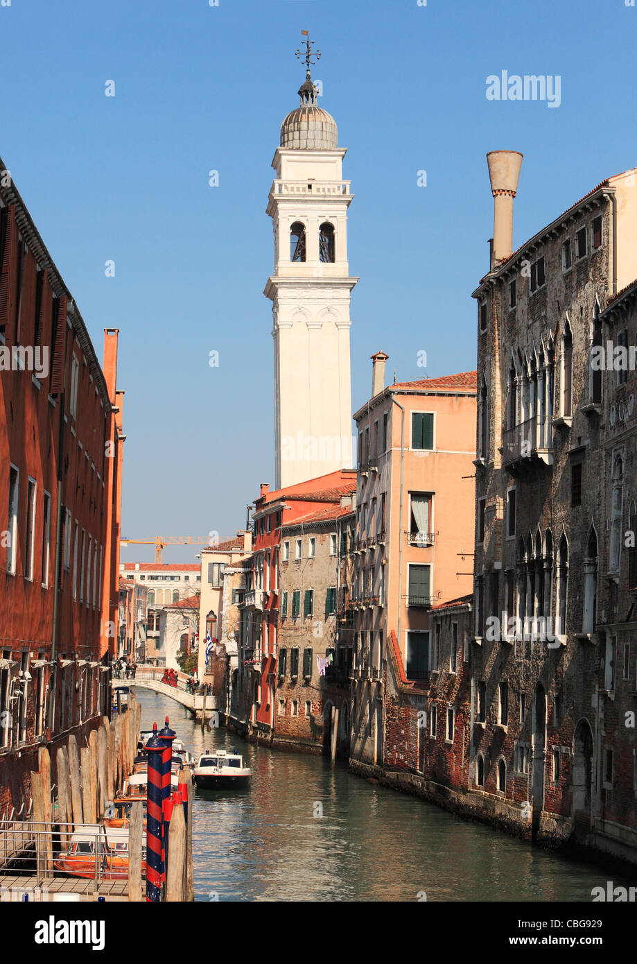 Image of a traditional narrow waterway between old buildings in Venice. Stock Photo