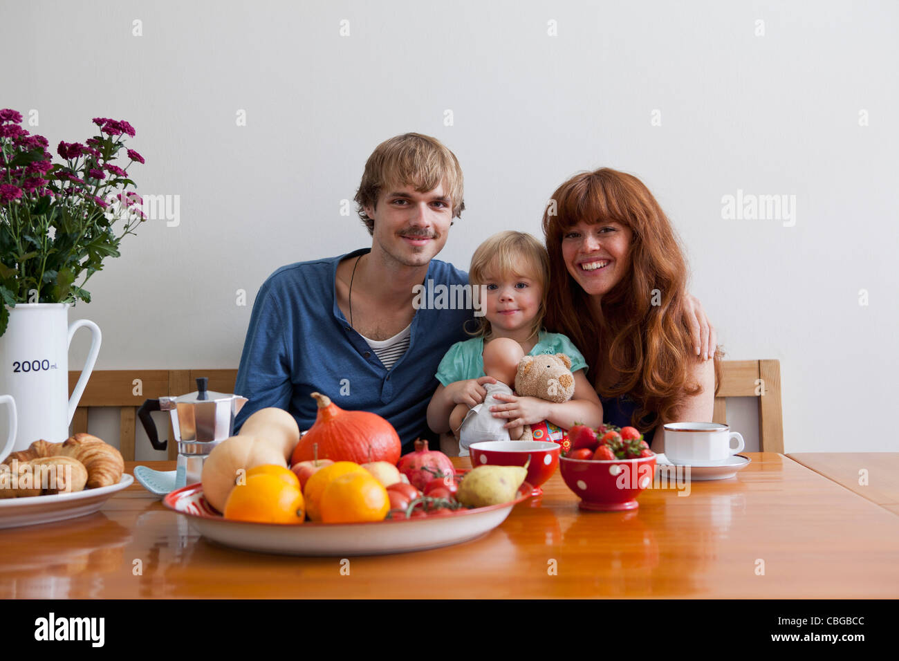 A young family having breakfast Stock Photo - Alamy
