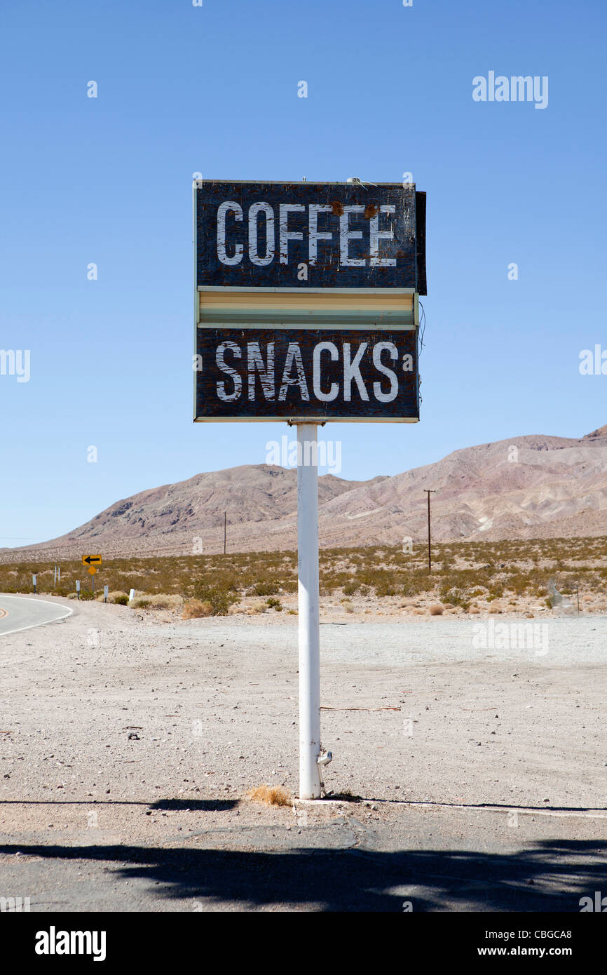 Roadside sign advertising coffee and snacks, Baker, California Stock Photo