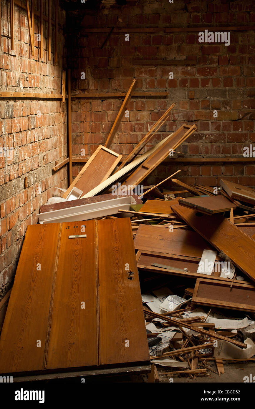 Broken up furniture in corner of room Stock Photo Alamy