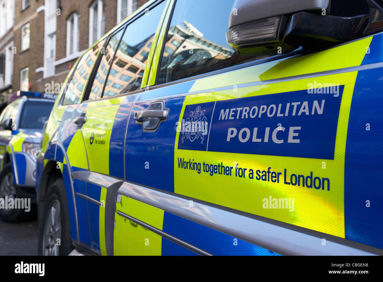 metropolitan police vehicles with battenburg chequered livery london england uk united kingdom Stock Photo