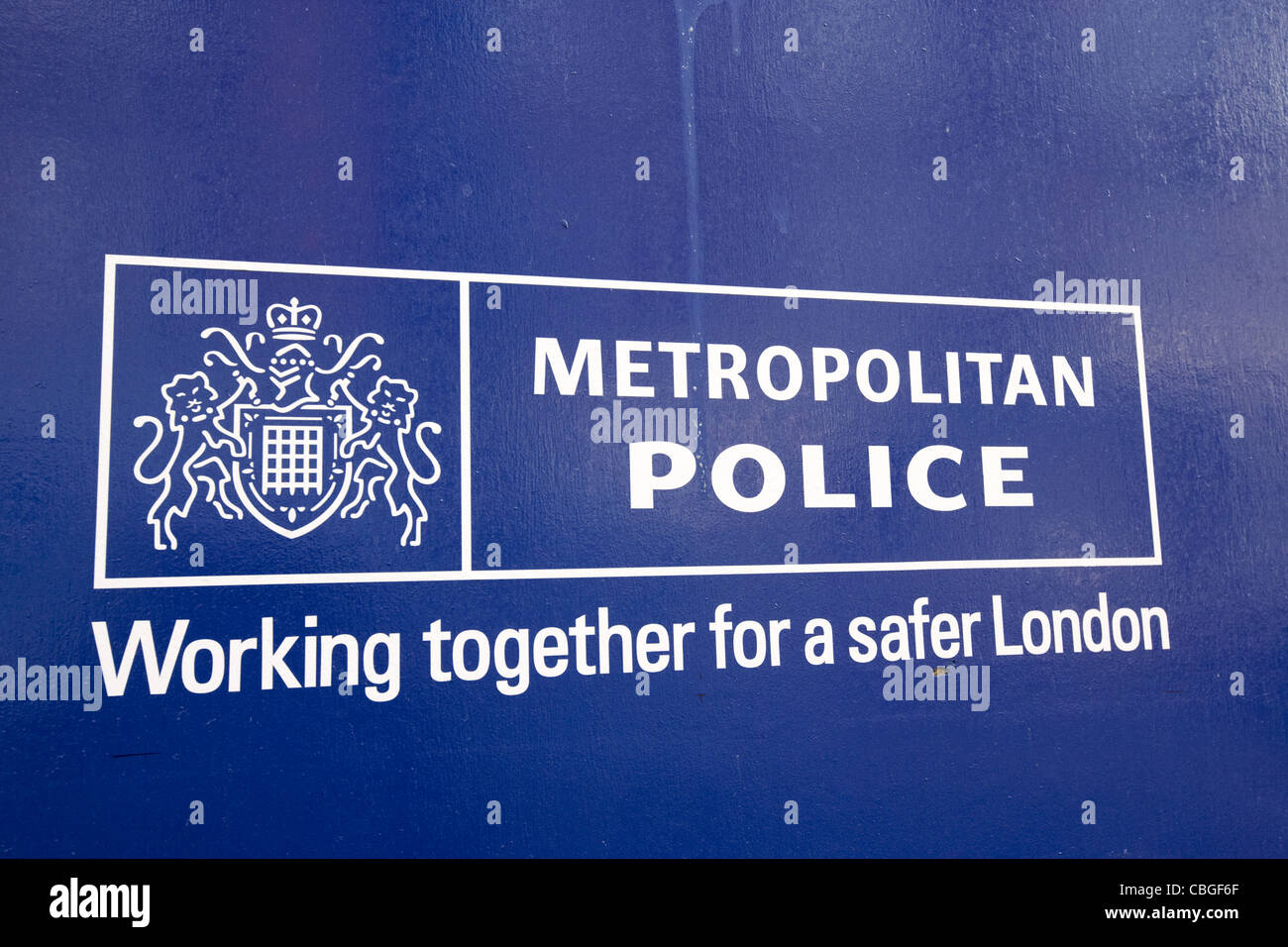 metropolitan police logo and working together for a safer london slogan london england uk united kingdom Stock Photo