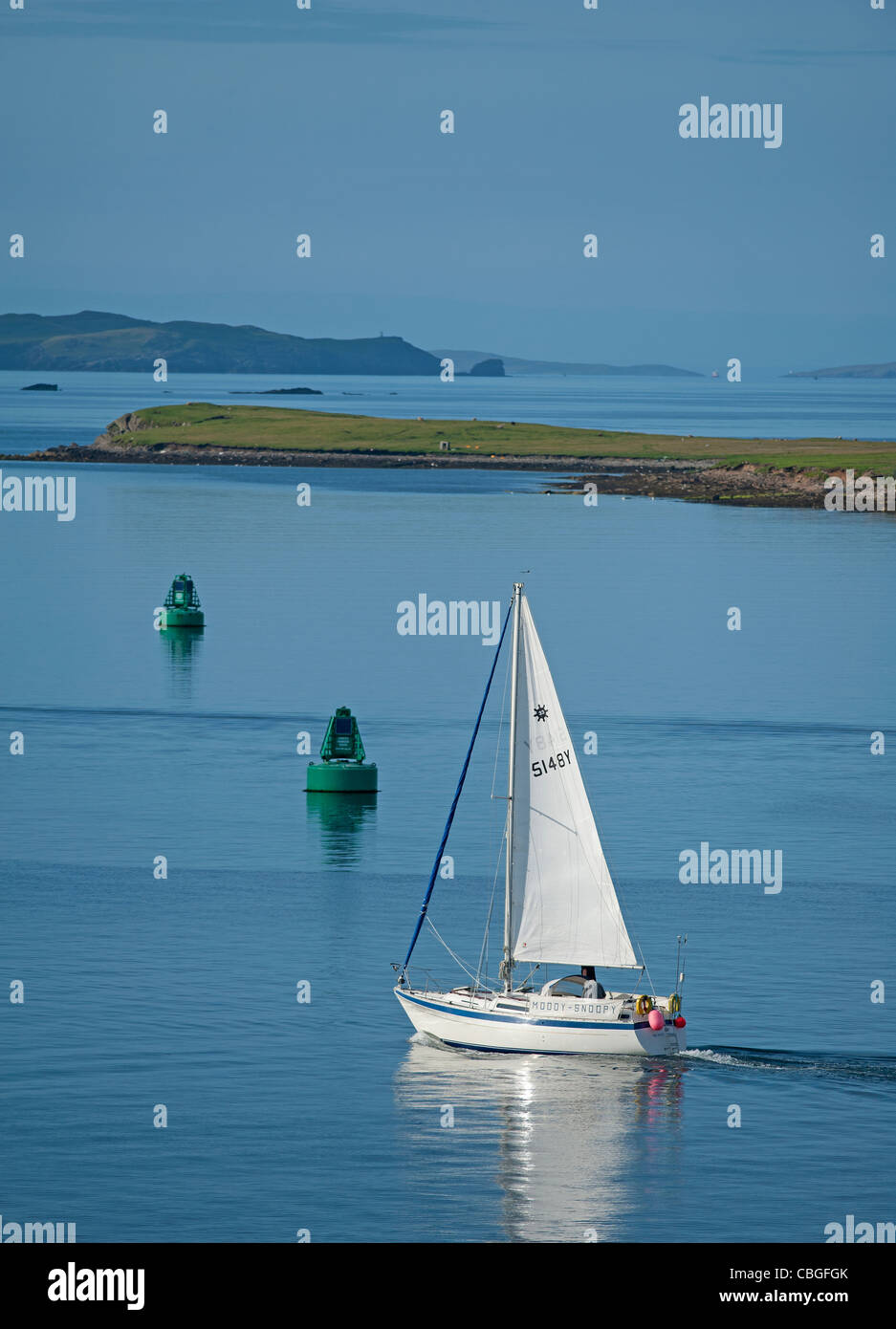 Small yacht sailing out from Lerwick into the Sound of Bressay in the Shetland Isles. SCO 7792. Stock Photo