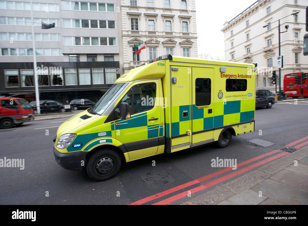 london ambulance service vehicle speeding through streets of london england uk united kingdom Stock Photo
