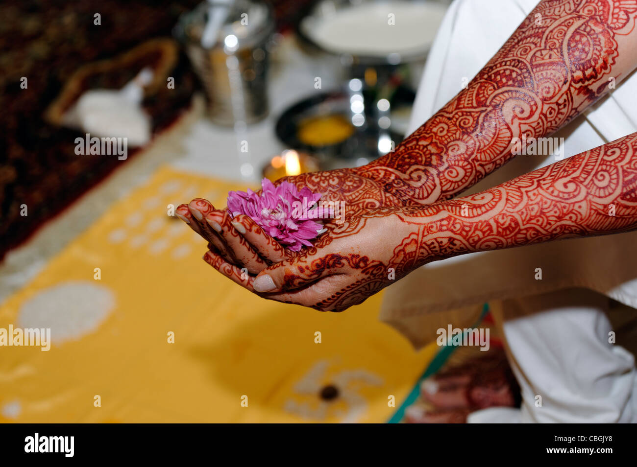 Indian Woman Holding Flowers During A Hindu Wedding Blessing