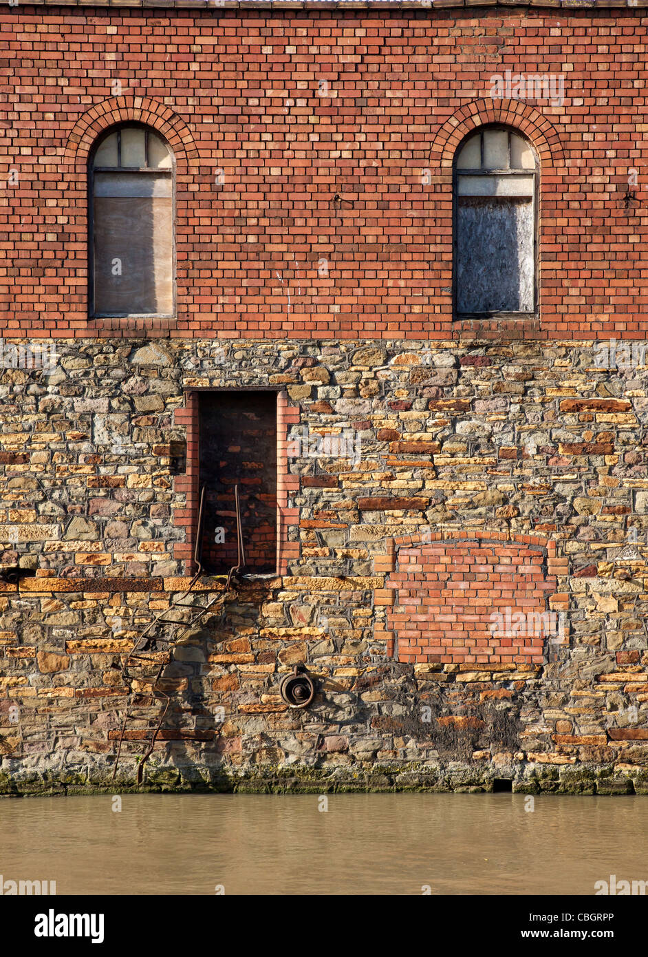 Door of a warehouse in Bristol opening down bent steps straight onto
