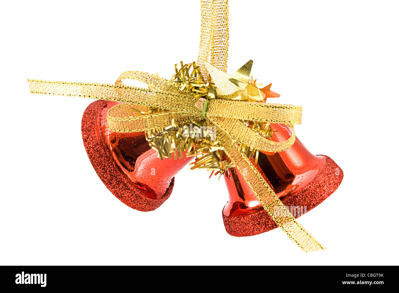 Red Christmas bells with a gold bow over white Stock Photo