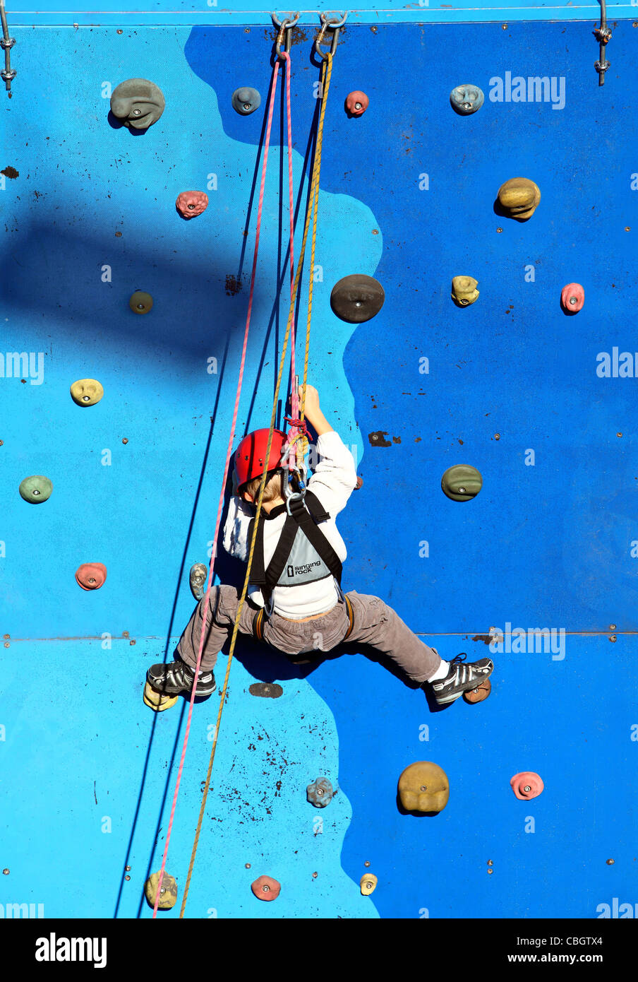 Young boy at a climbing wall. Stock Photo