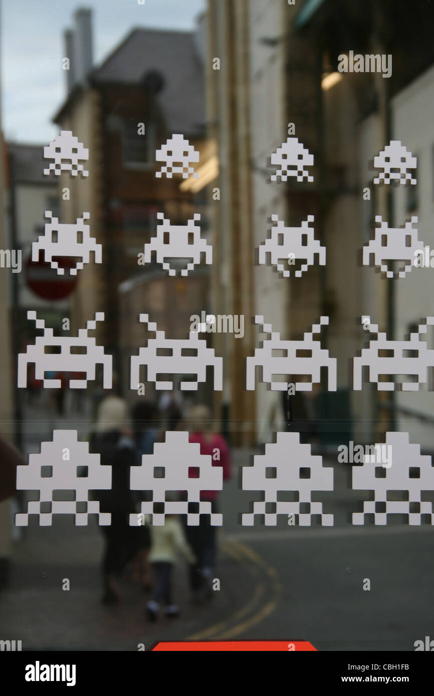 space invaders game image on computer games shop window in wales great britain uk Stock Photo
