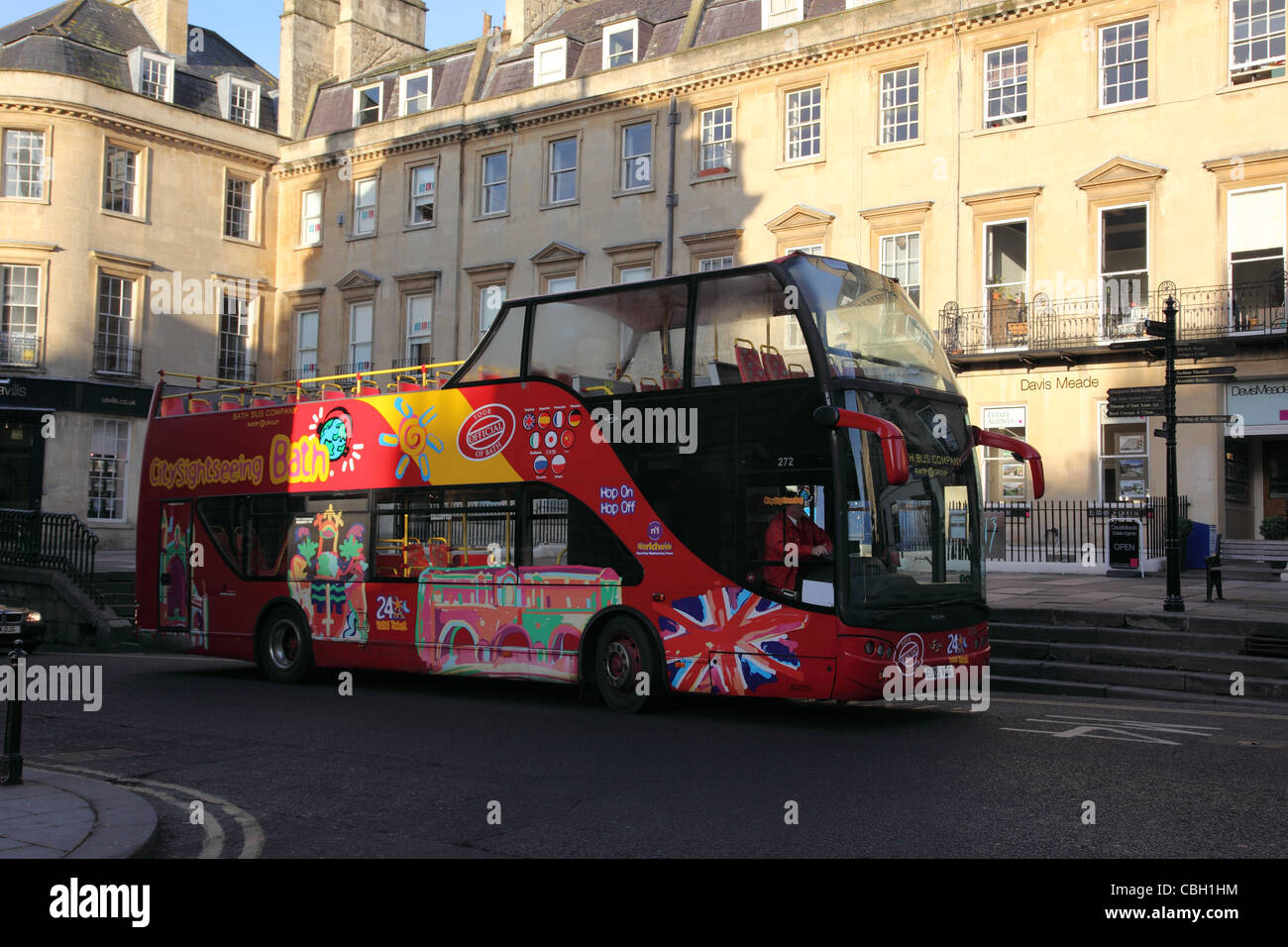 Red city sightseeing tour bus, Bath city centre, England Stock Photo