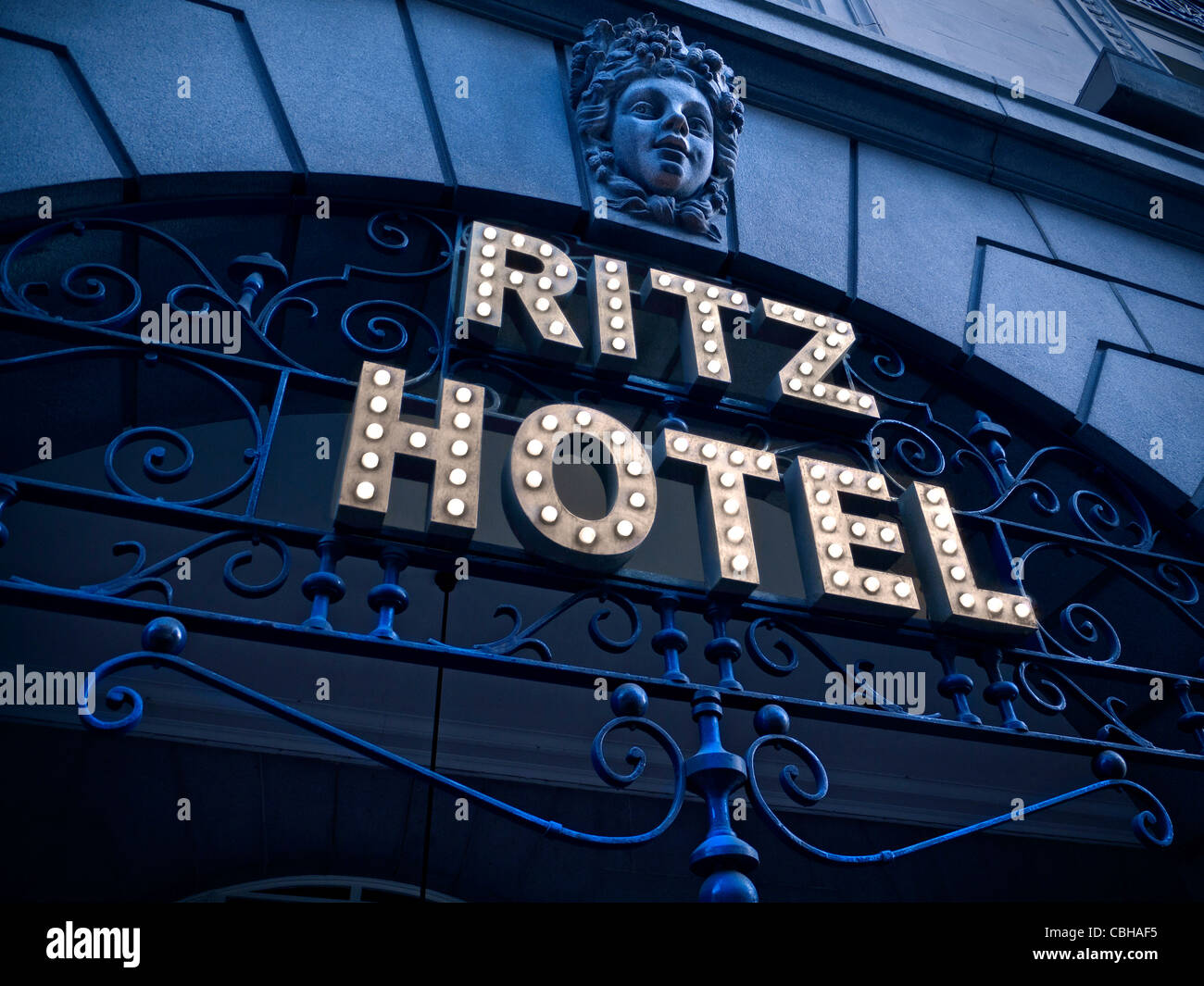 RITZ HOTEL SIGN LIGHTS DUSK Entrance sign to The Ritz Hotel a discreet luxury 5-star hotel in Piccadilly London UK Stock Photo