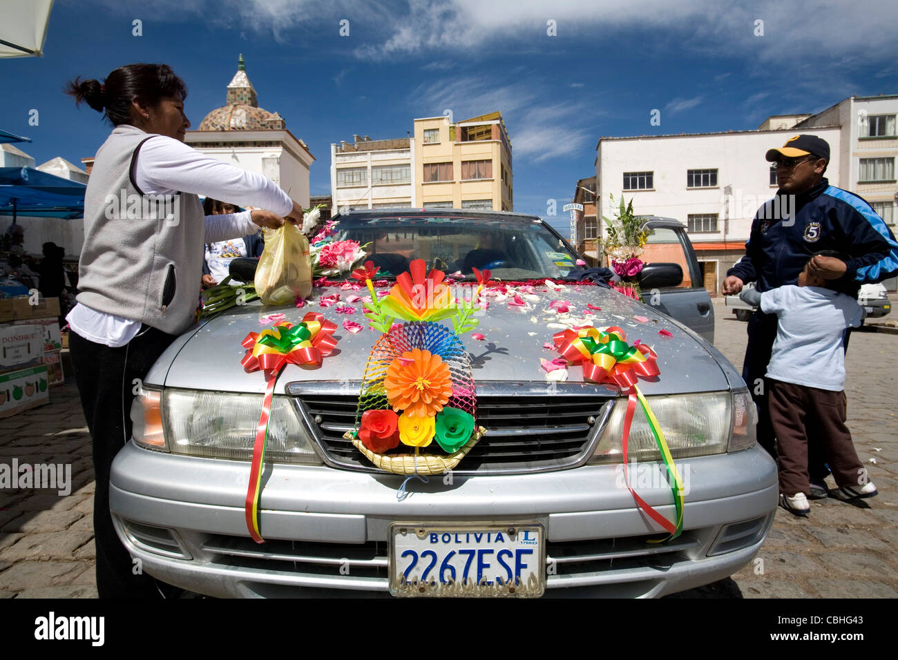 A Bolivian family is preparing their car to be blessed in front by a priest Copacabana Cathedral, Bolivia Stock Photo