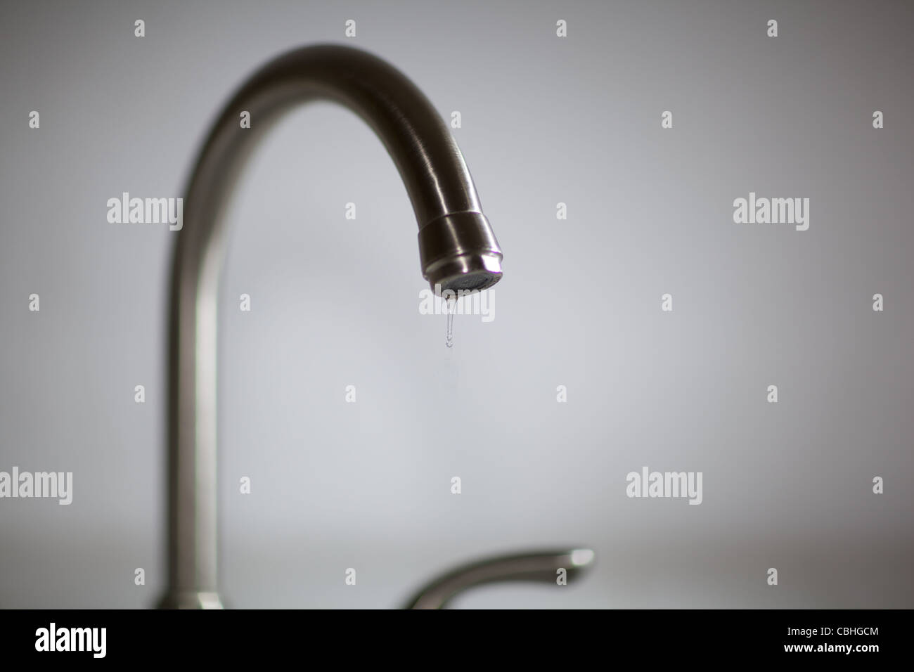 Dripping water faucet Stock Photo