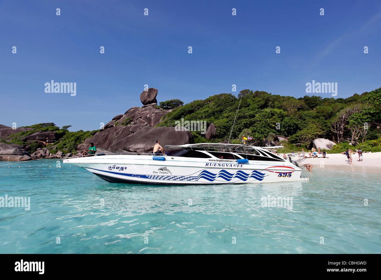 Speedboat and Sailing Rock on Similan island in the Similan Islands, Phang-Nga, near Phuket, Thailand Stock Photo