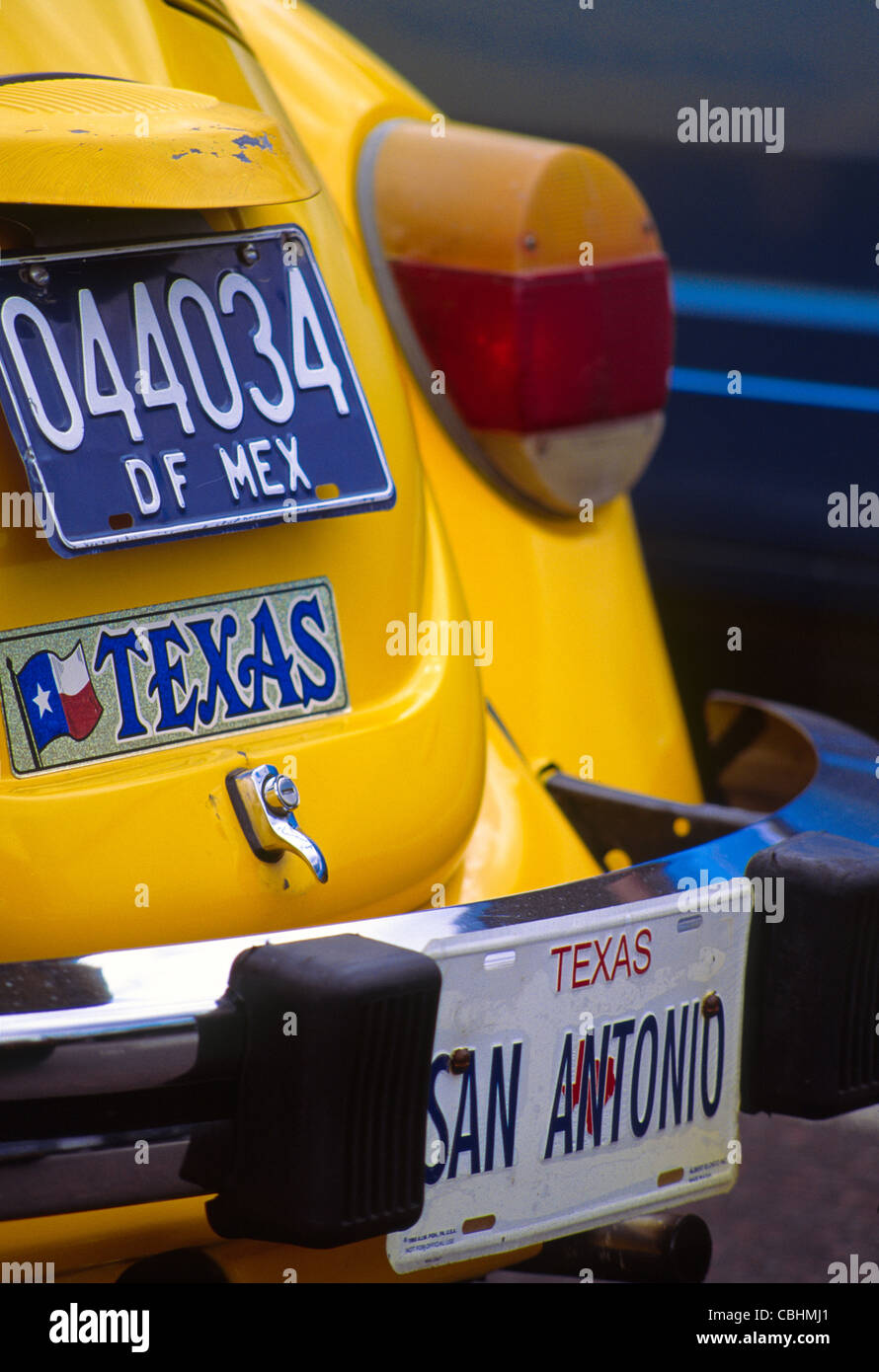 Yellow car with Mexico license plate, Texas license plate "San Antonio