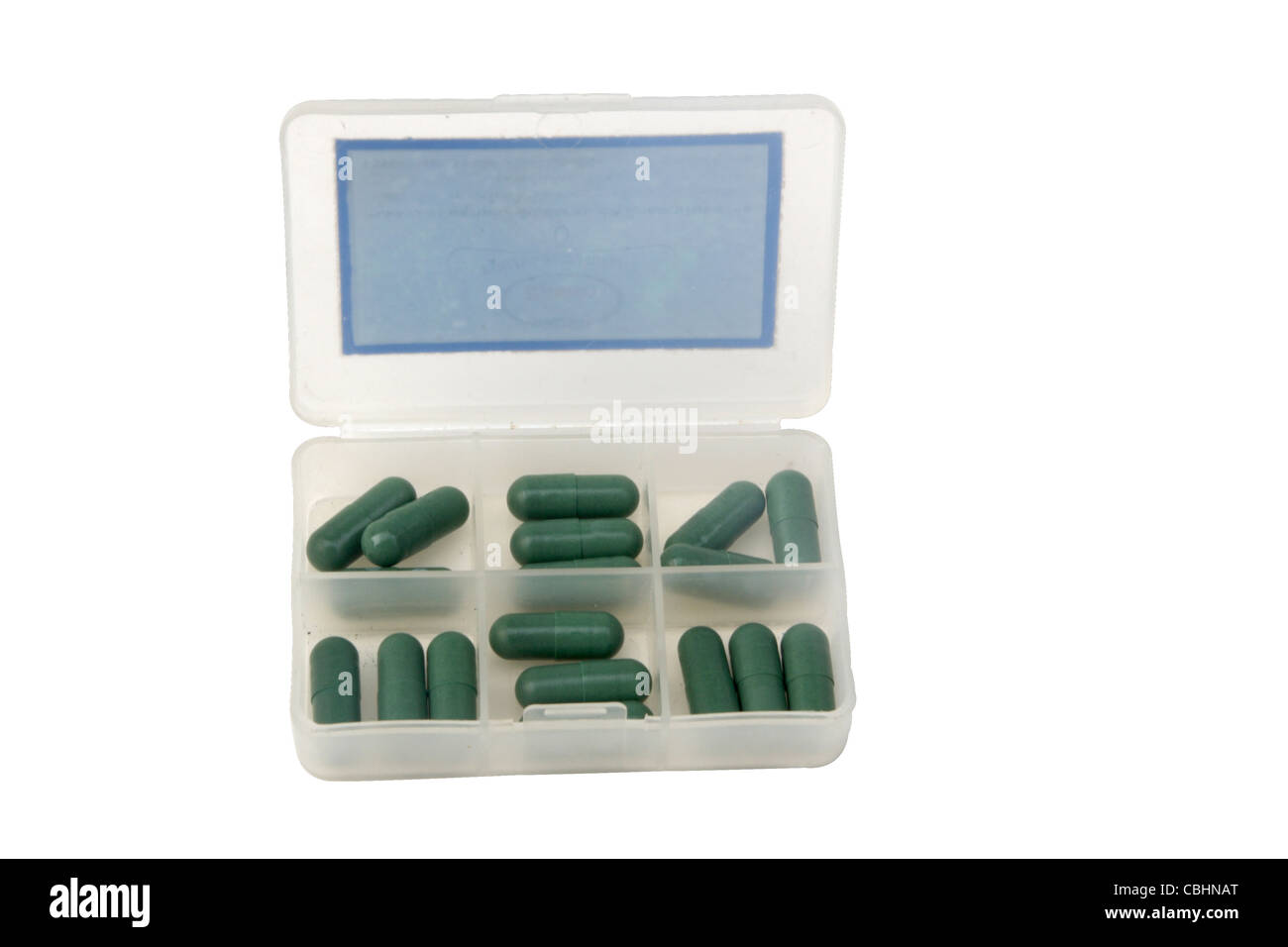 Green capsules in Pill box on white backgroud. included clipping path. Stock Photo