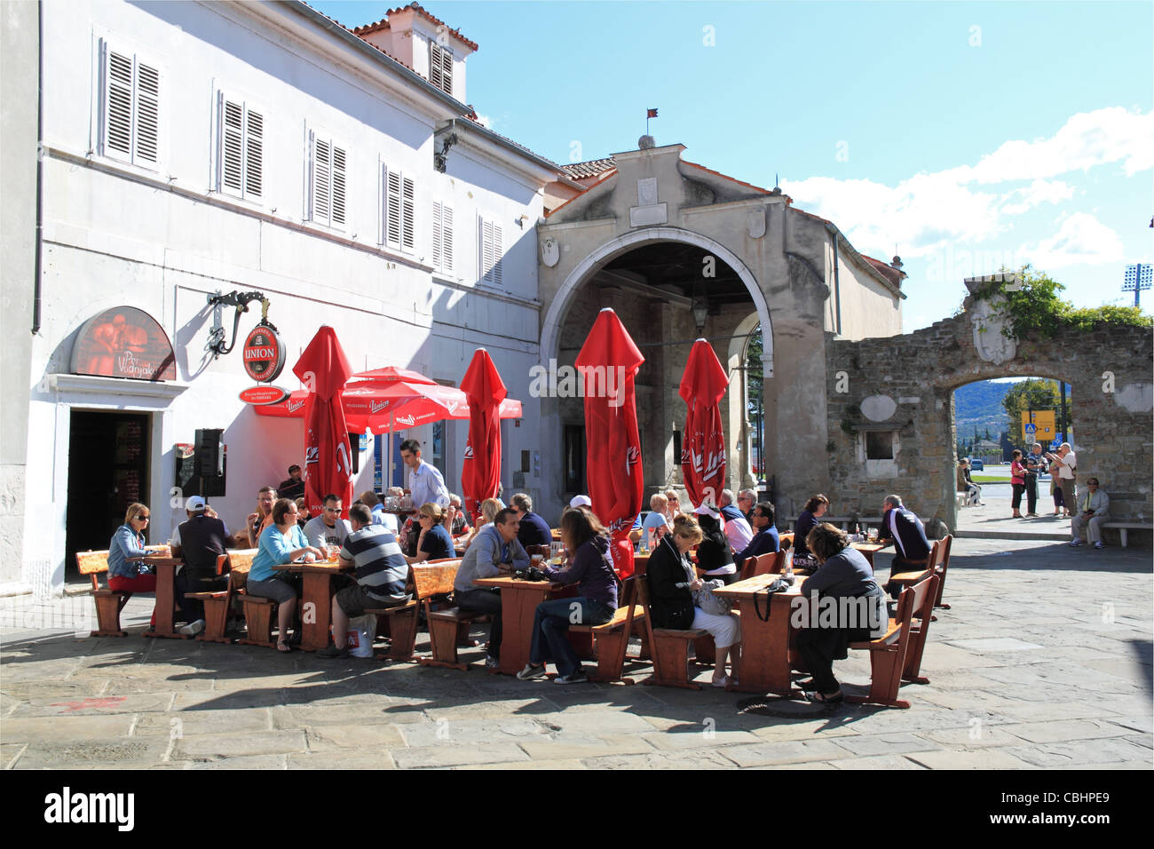 Pri Vodnjaku bar and Muda Gate, Preseren Square, Koper, Capodistria, Primorska, Slovenia, Istria, Balkans, Adriatic Sea, Europe Stock Photo