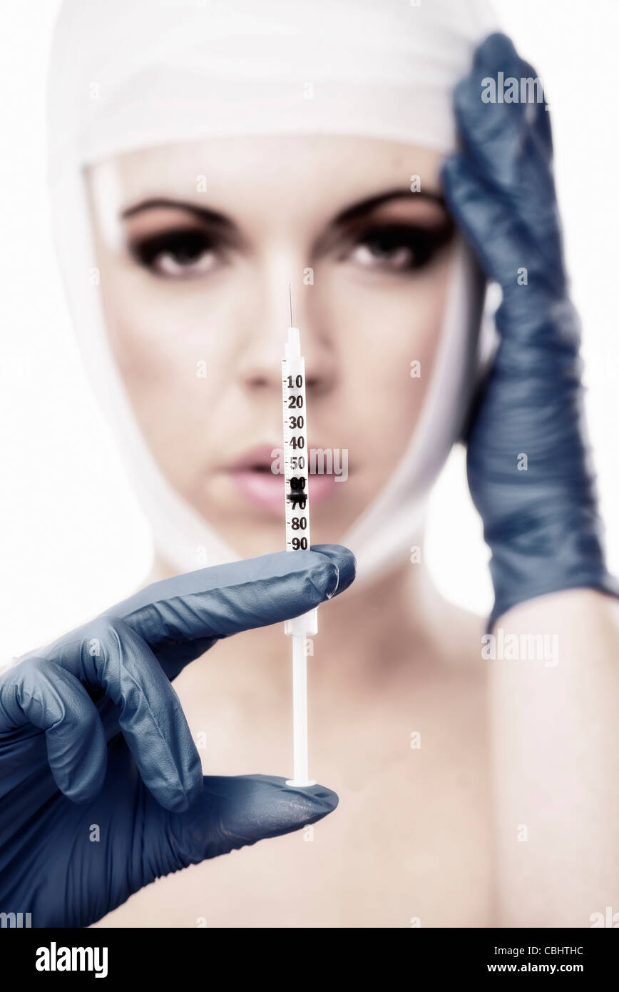 woman holding a syringe Stock Photo Alamy