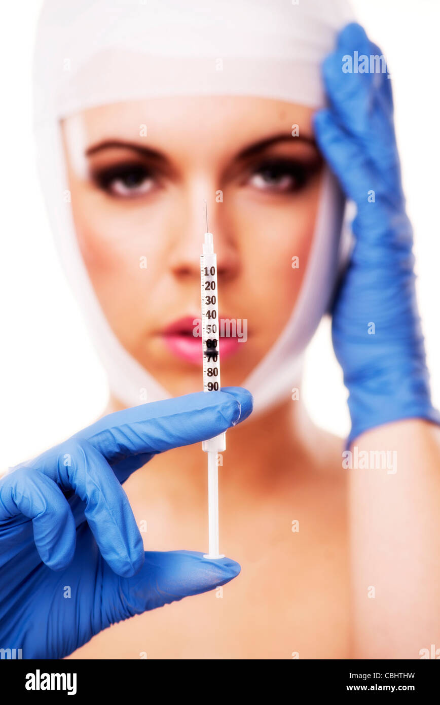 woman holding a syringe Stock Photo