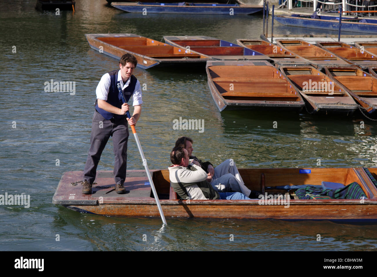 Tourists punting along River Cam, Cambridge, England, UK Stock Photo