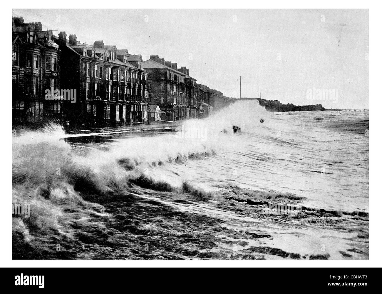 Blackpool Lancashire England pier seaside resort storm crashing waves wave raining rain tide tidal water damage rough day Stock Photo