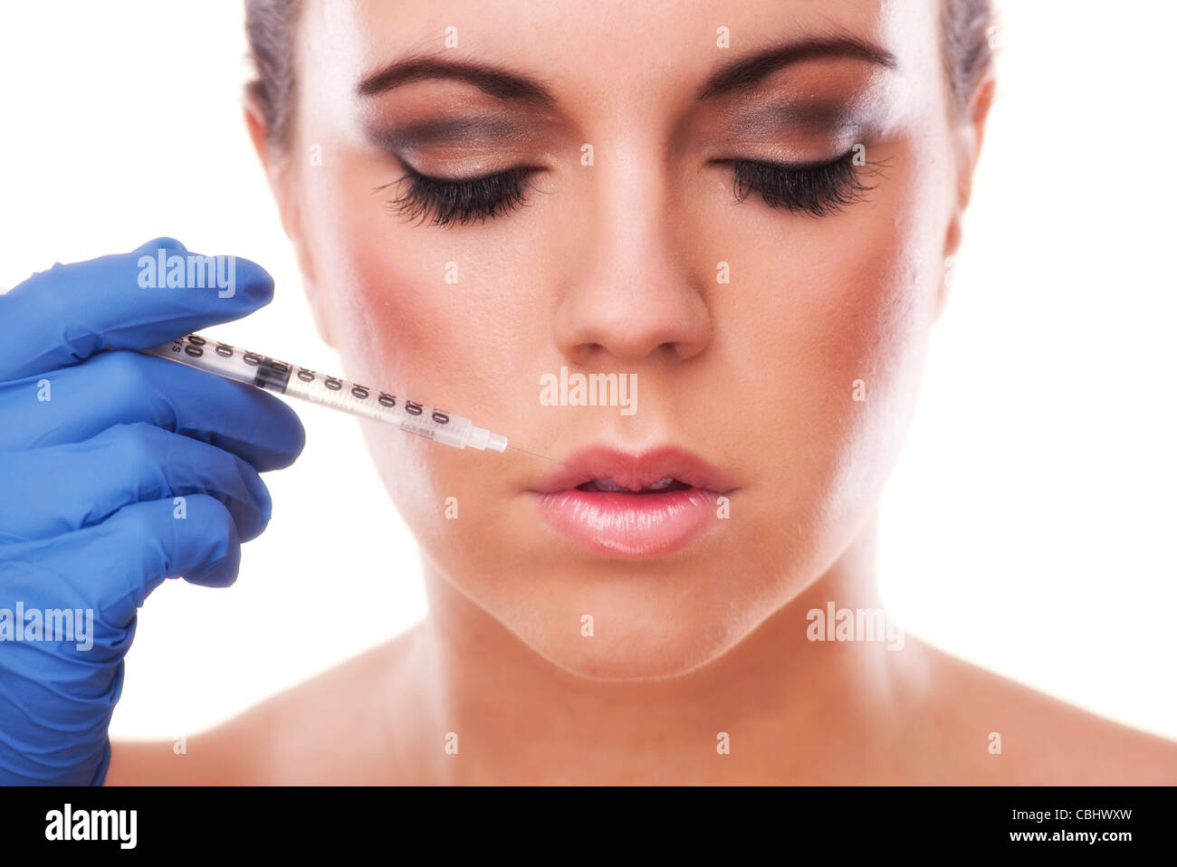 woman having lip plumping injection into lips Stock Photo Alamy