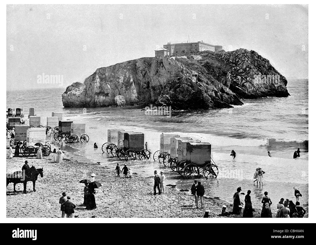 Tenby St Catherine's Castle bastion Palmerstone Fort seaside town Pembrokeshire Bay sandy beach bathing machine carriage Stock Photo