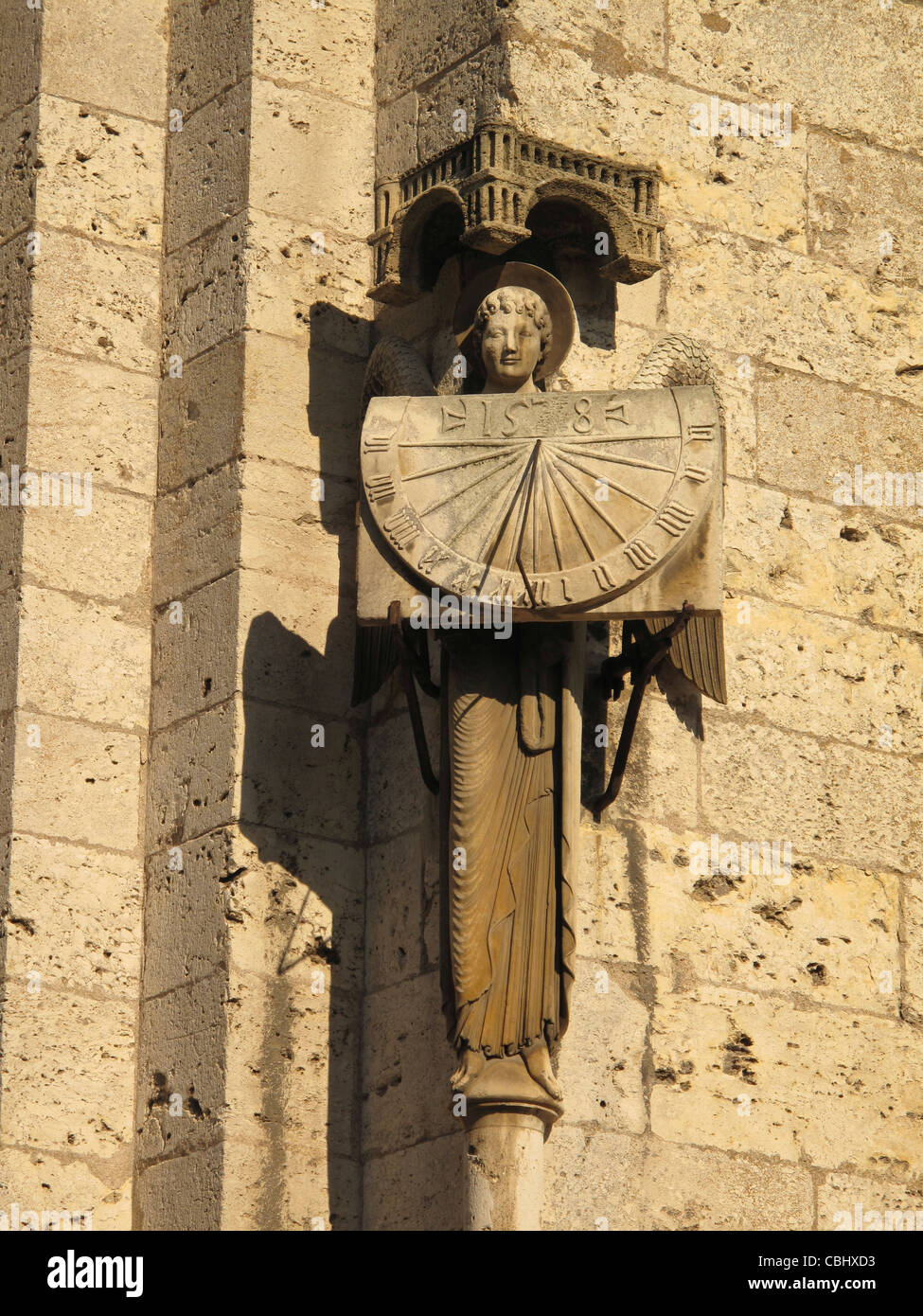 Angel with sundial,Notre-Dame de Chartres cathedral,Chartres,Eure-et-Loire, France,Way of St James to Santiago de Compostela, UN Stock Photo