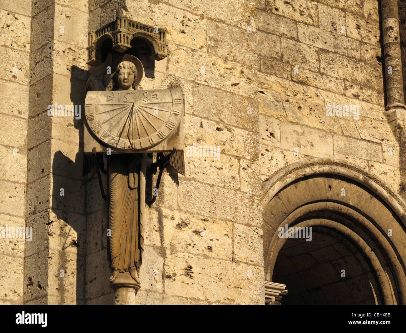 Angel with sundial,Notre-Dame de Chartres cathedral,Chartres,Eure-et-Loire, France,Way of St James to Santiago de Compostela, UN Stock Photo
