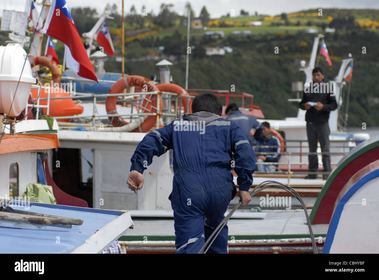Workers at the Harbour of Achao,  Quinchao Island, Chiloe, Lake's District, Chile Stock Photo