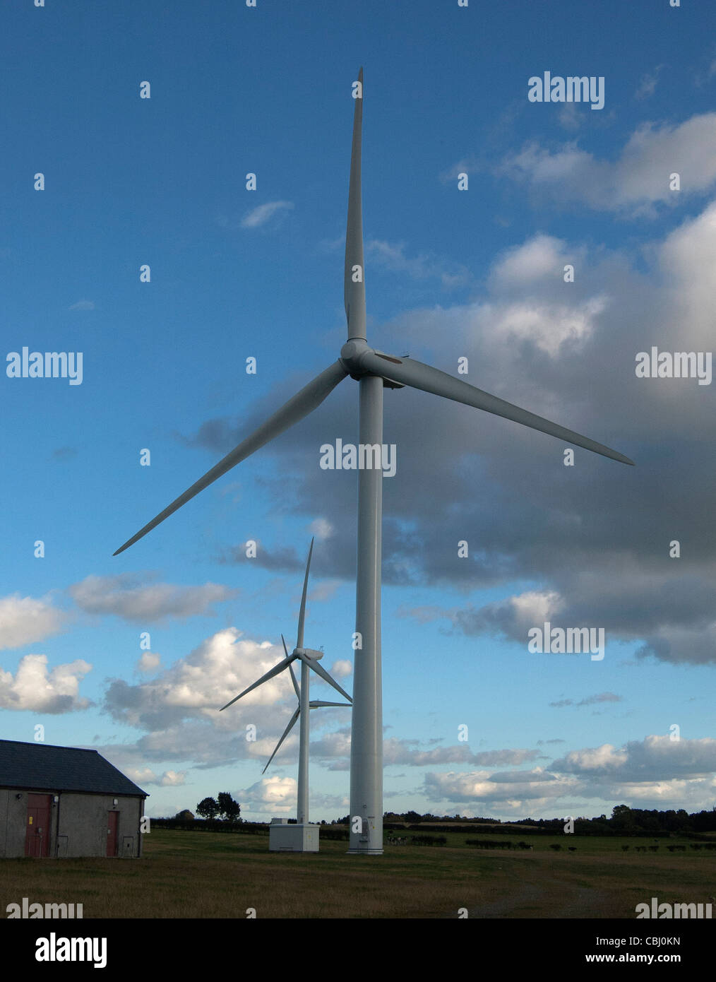 Cloudy sky with a view of wind turbines Stock Photo - Alamy
