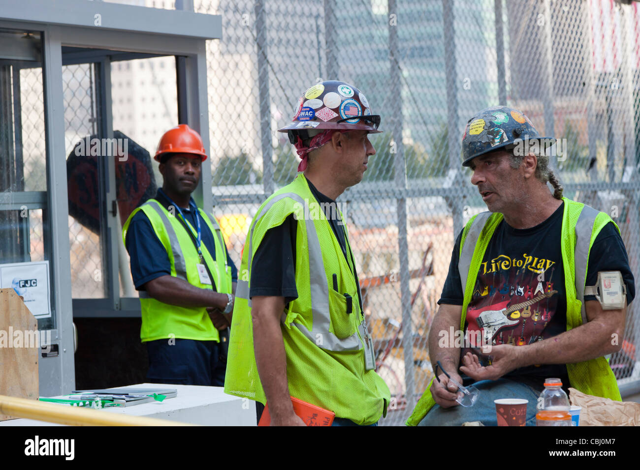 Construction workers take a break at the World Trade Center construction site in New York City. Stock Photo