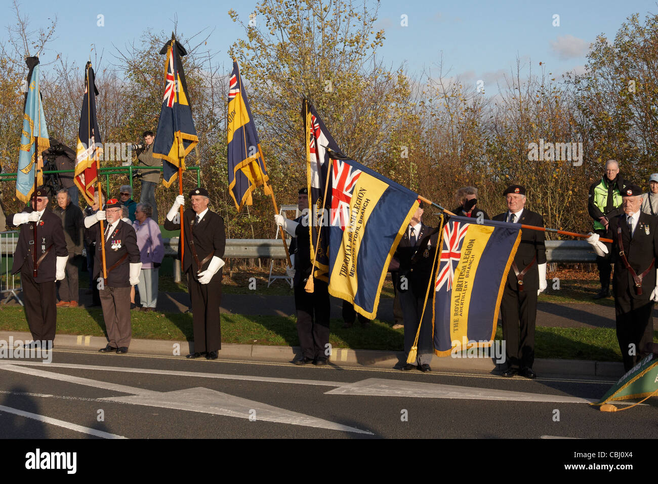 Standard bearers lower their flags during the repatriation ceremony for